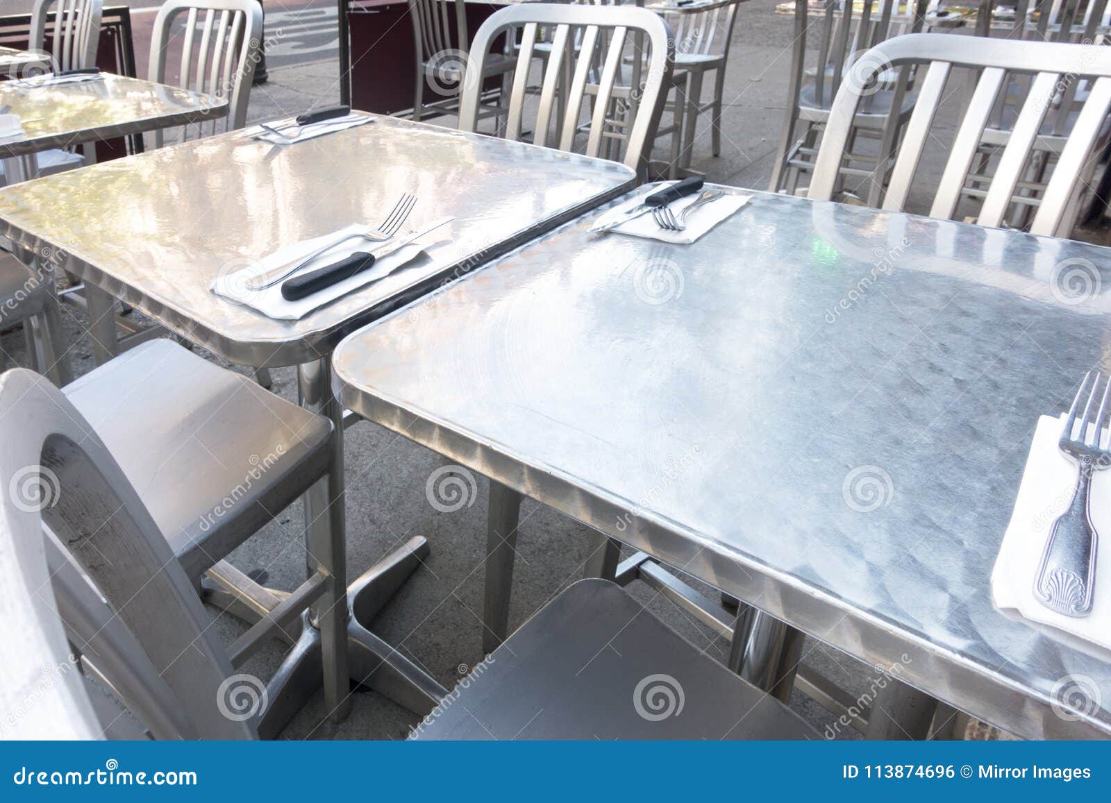 Stainless Steel Outdoor Restaurant Table And Chairs Stock Photo