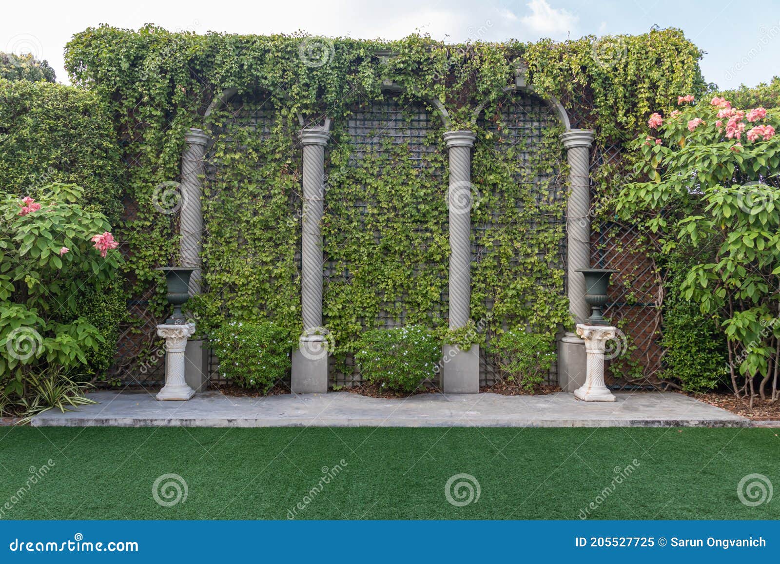 Outdoor Backdrop of Stone Brick Wall Covered with Ivy in Garden Stock