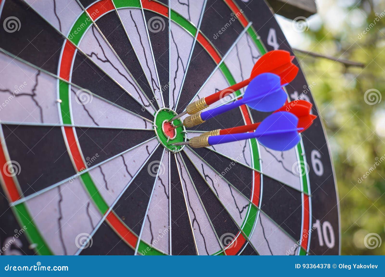 Outdoor flying darts game stock photo. Image of bokeh 93364378