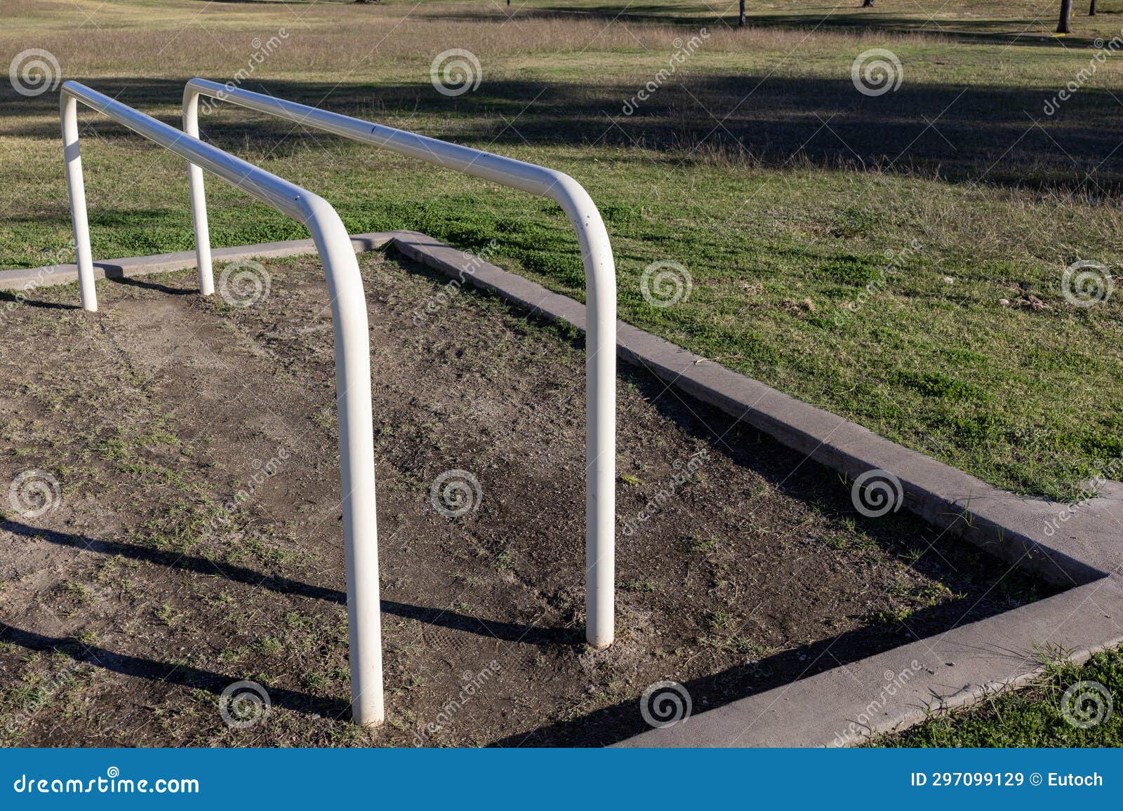 outdoor low rise white symmetrical fitness bars