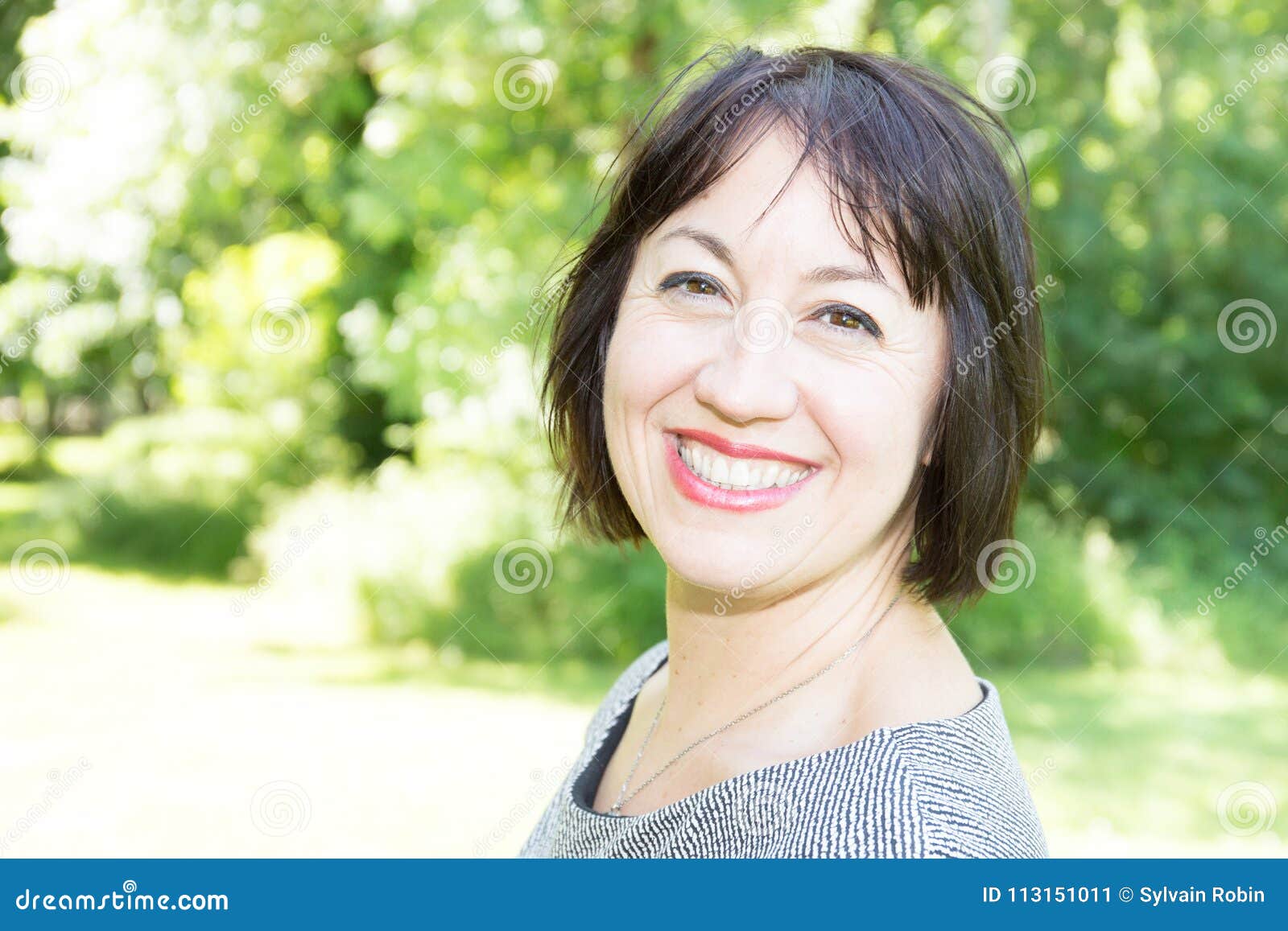 Portrait Of A Beautiful Middle Aged Brunette Woman In Forties Years