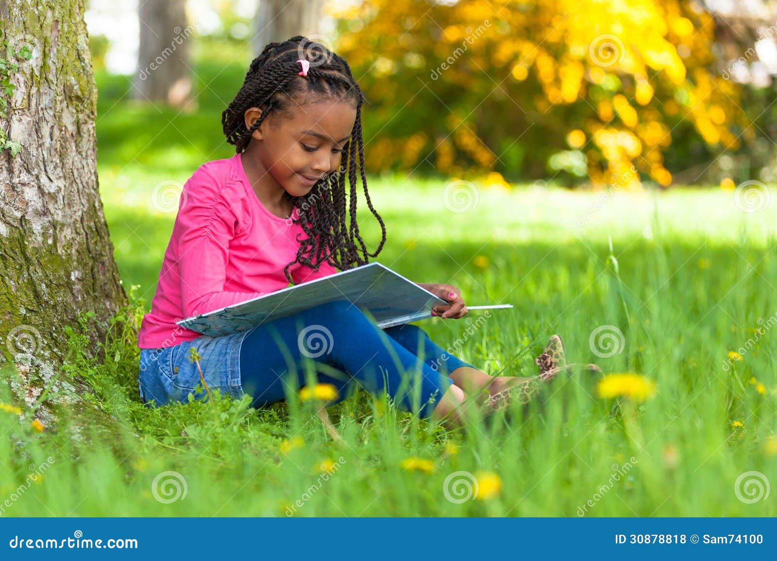 Outdoor Portrait Of A Cute Young Black Little Girl Reading A Boo Stock Photo Image Of Fresh