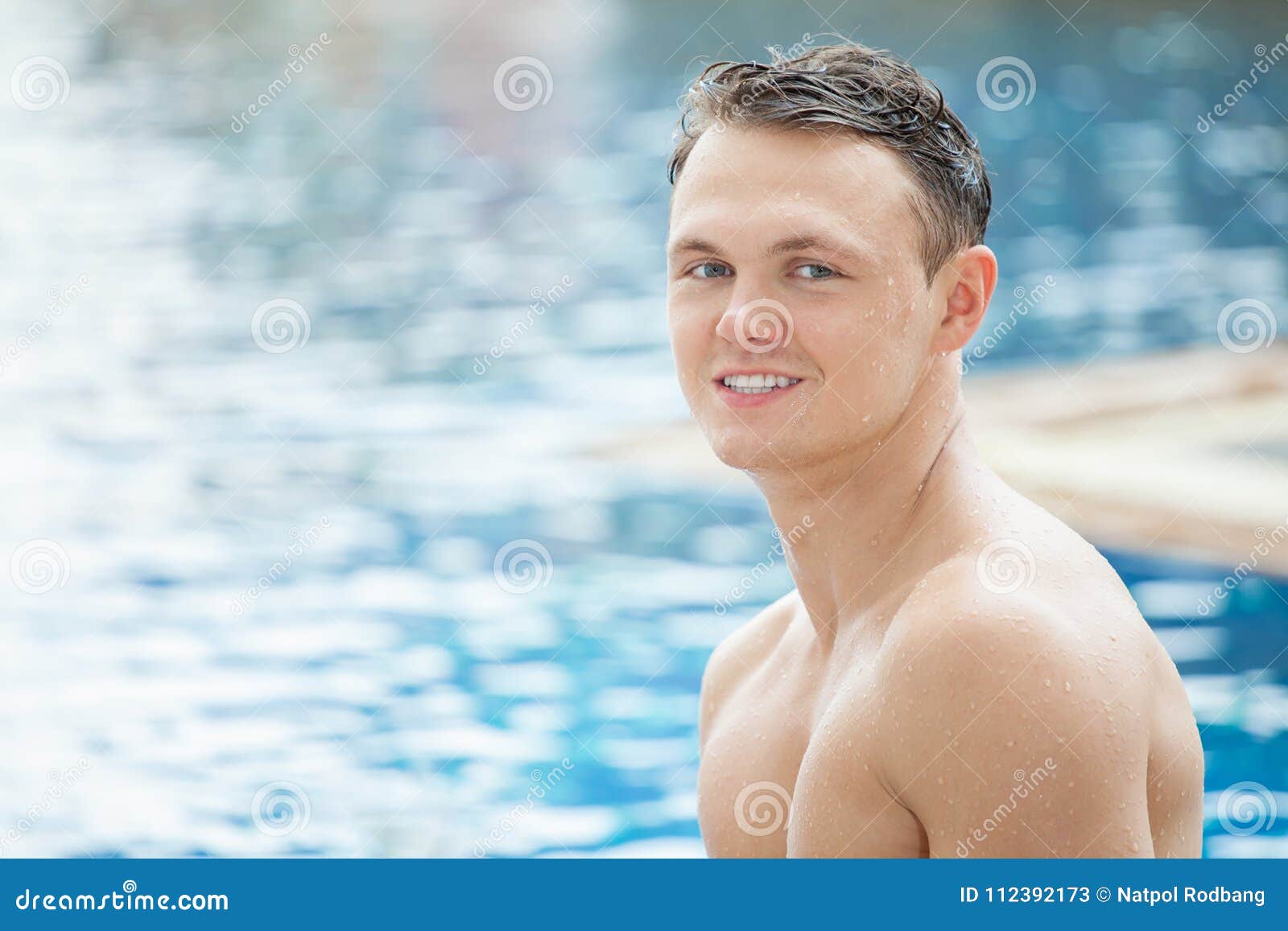 Outdoor Portrait of Handsome Man Posing at Swimming Pool Stock Image