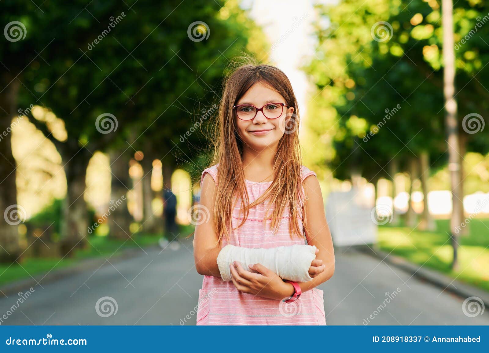 portrait of sweet little girl with a cast