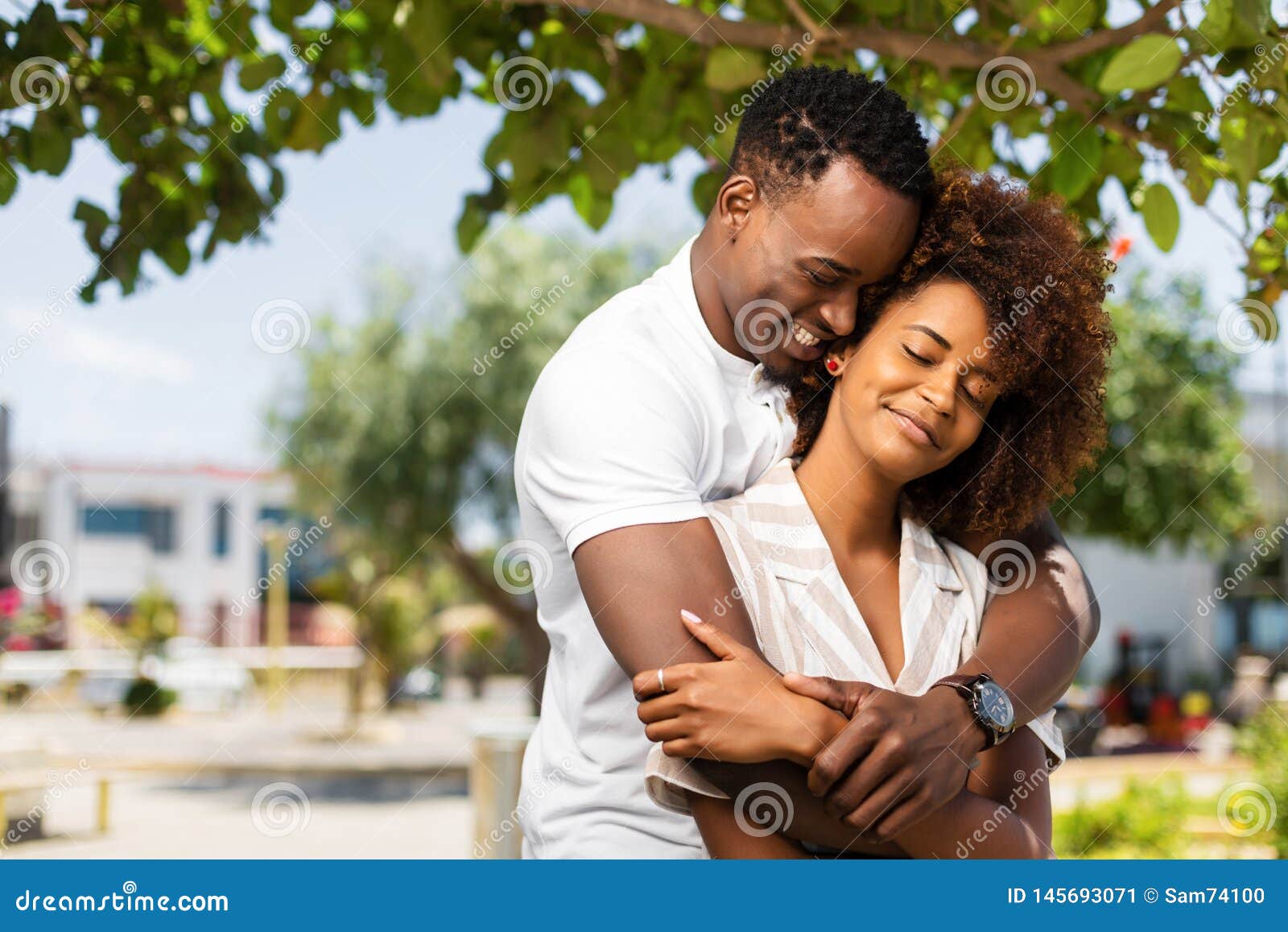 Outdoor Protrait Of African American Couple Embracing Each Other Stock