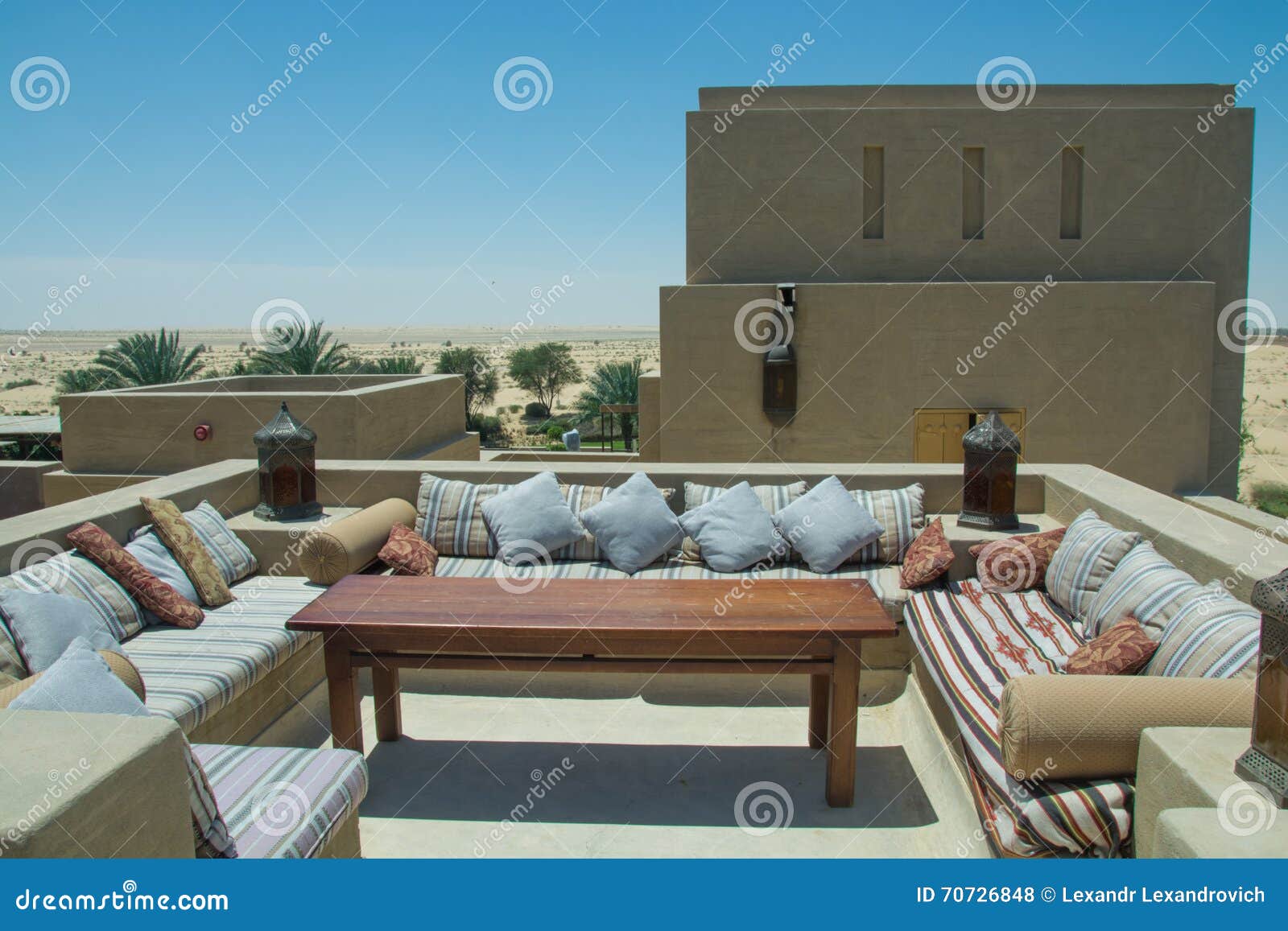 Outdoor Restaurant Lounge with Sofas Table and Comfortable Pillows at