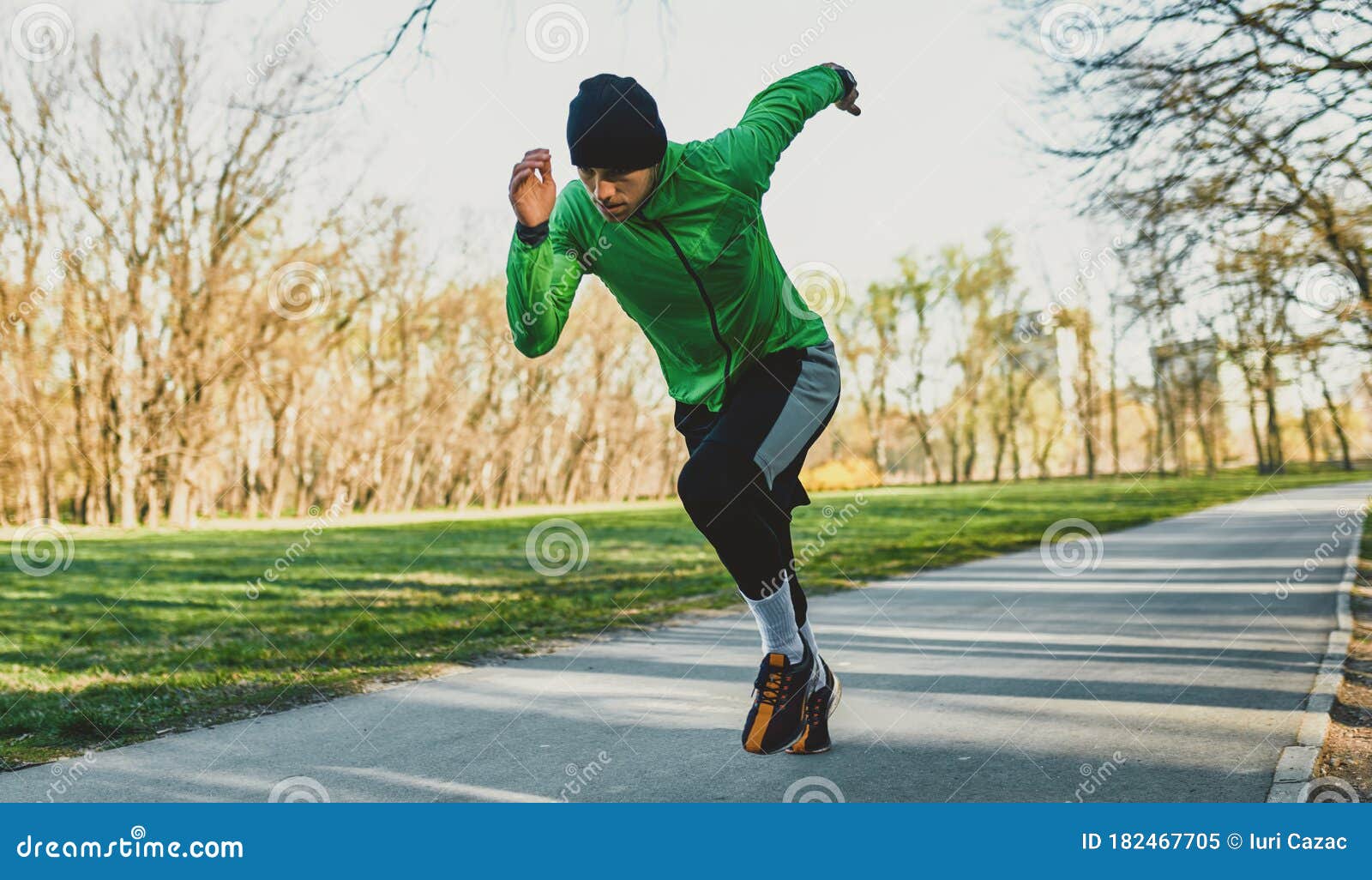 Outdoor Shot Of A Jogger Young Man Running On A Trail Athletic Male
