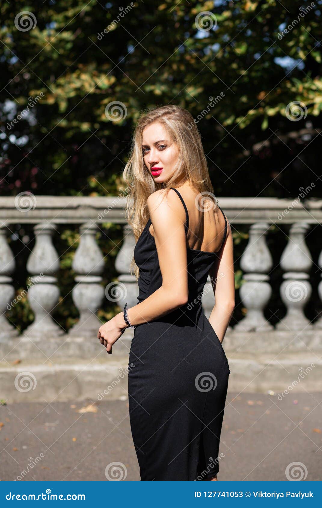 Outdoor Shot of Seductive Blonde Woman with Lush Hair Wearing Bl Stock ...