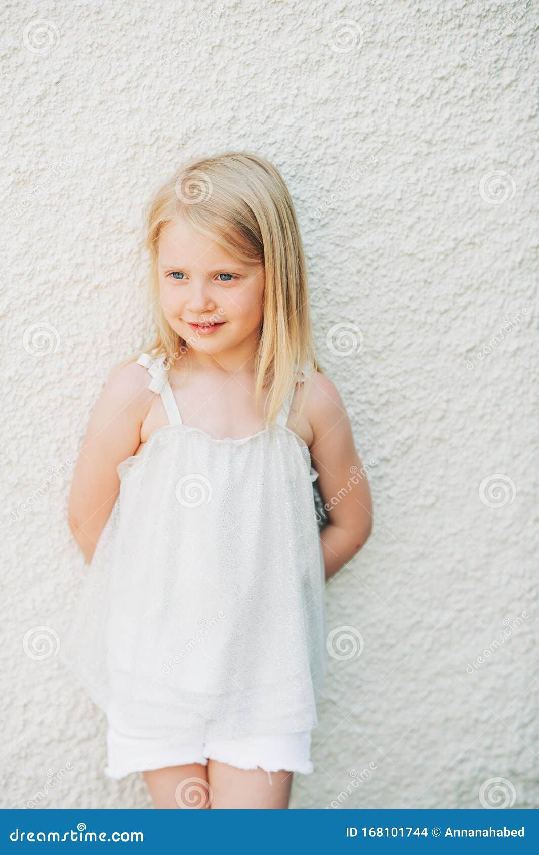 Outdoor summer portrait of adorable 5 year old little girl wearing