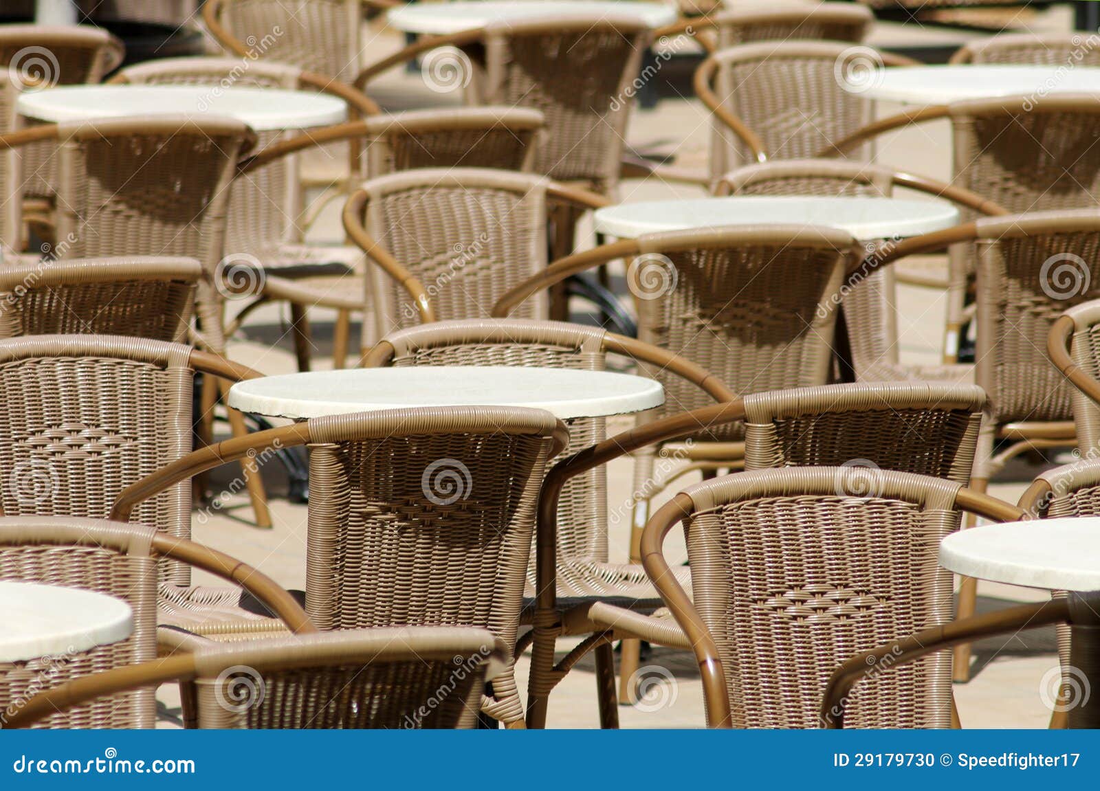 Outdoor tables and chairs in seating area.