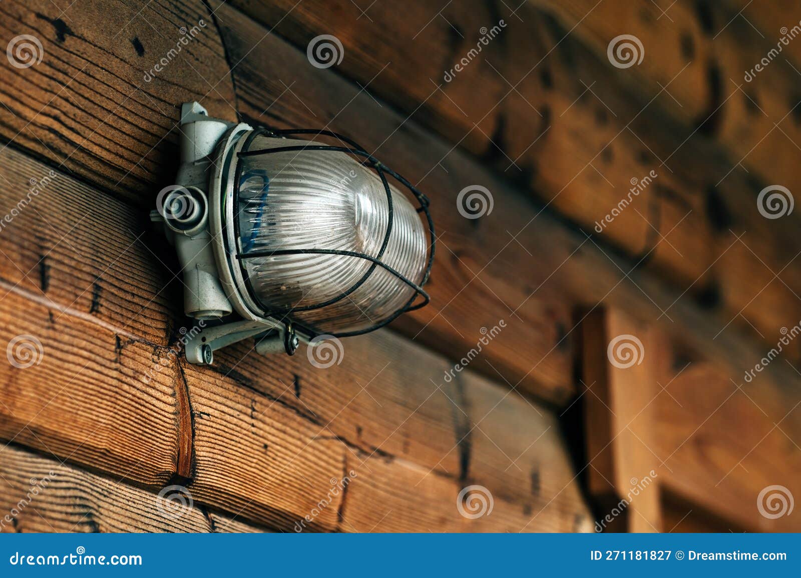 outdoor wall light on lodging cottage wooden door