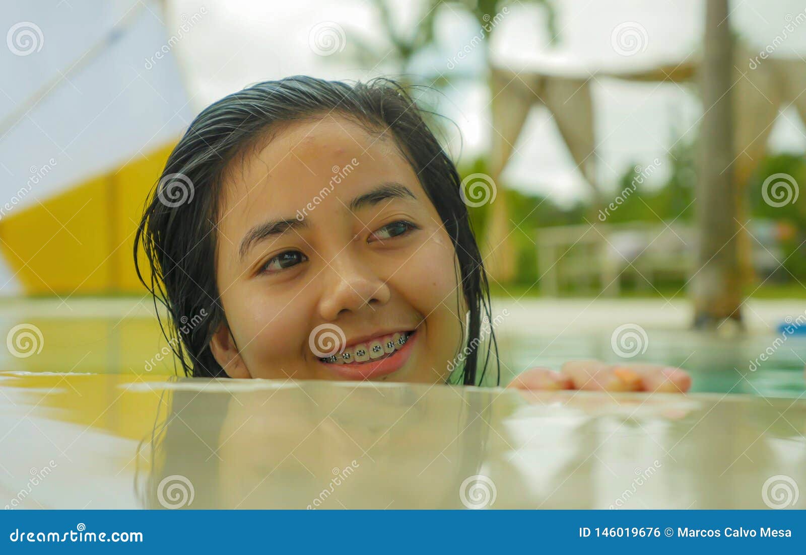 Teenage girl with braces wearing bikini - Stock Photo - Masterfile -  Premium Royalty-Free, Code: 6122-07703978