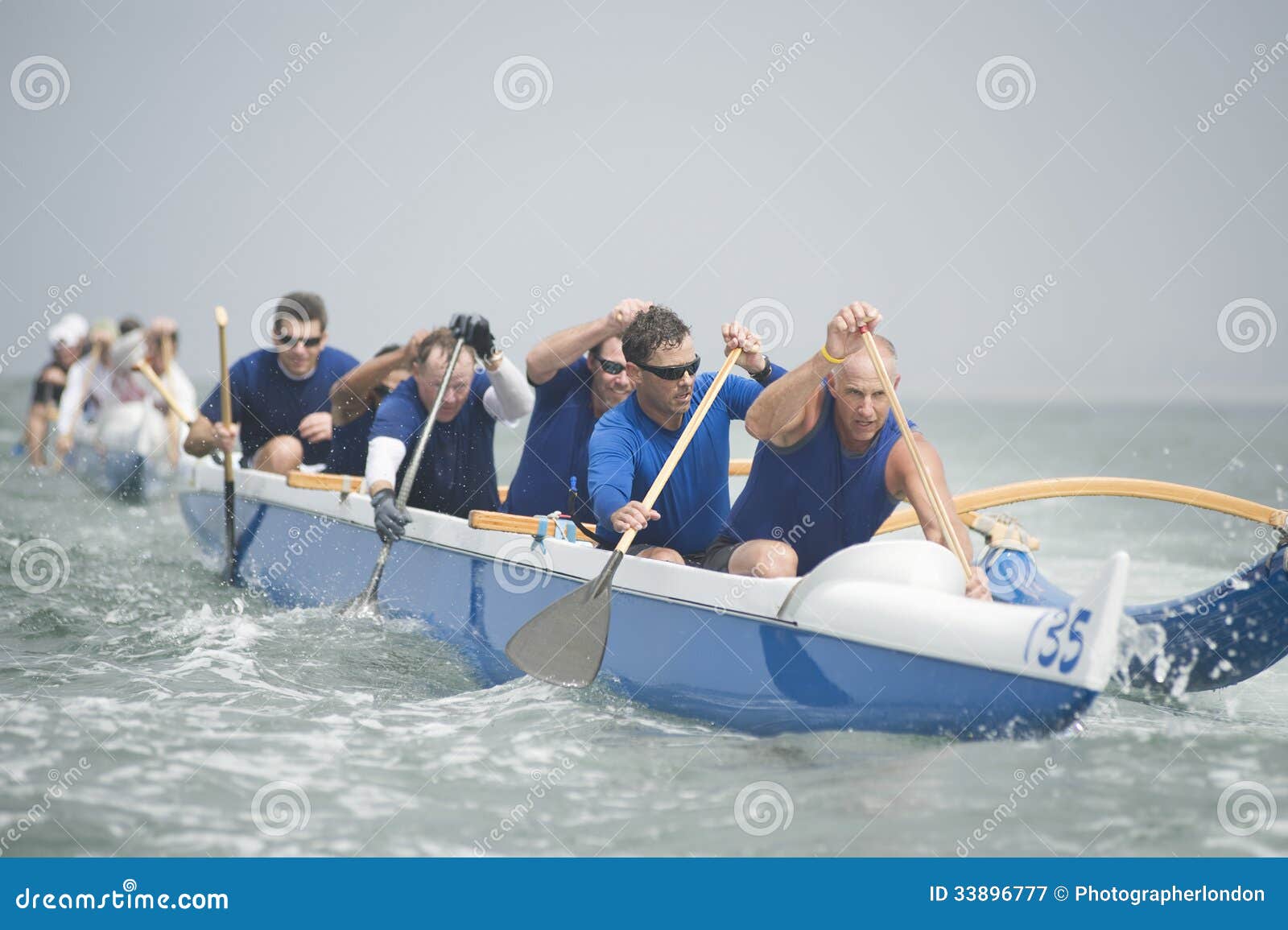 Outrigger Canoeing Team In Race Stock Image - Image of ... Outrigger Canoeing Team In Race Stock Image - Image of ...