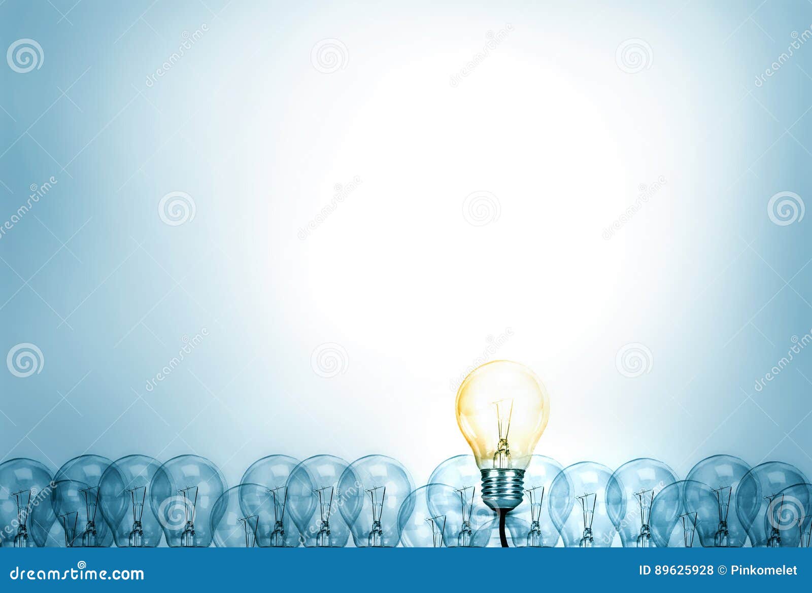 outstanding creative idea background concept . one light bulb glowing among a group light bulbs.