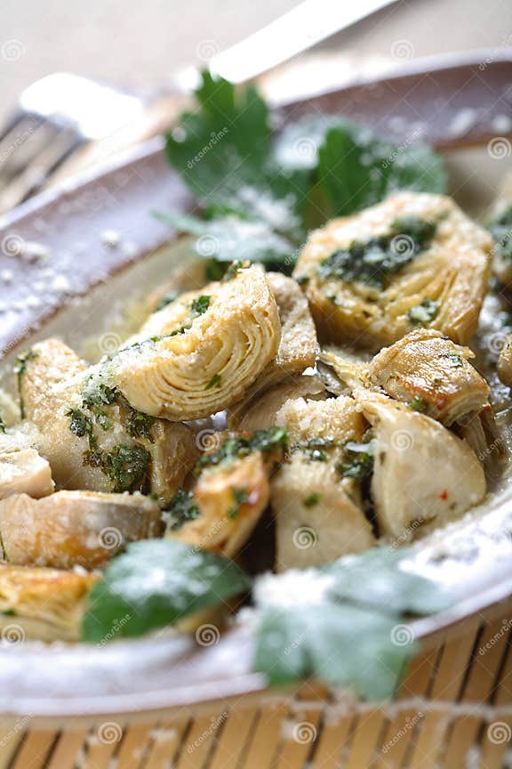 Oven Artichoke on the Plate Stock Photo Image of herbs, plate 2472310