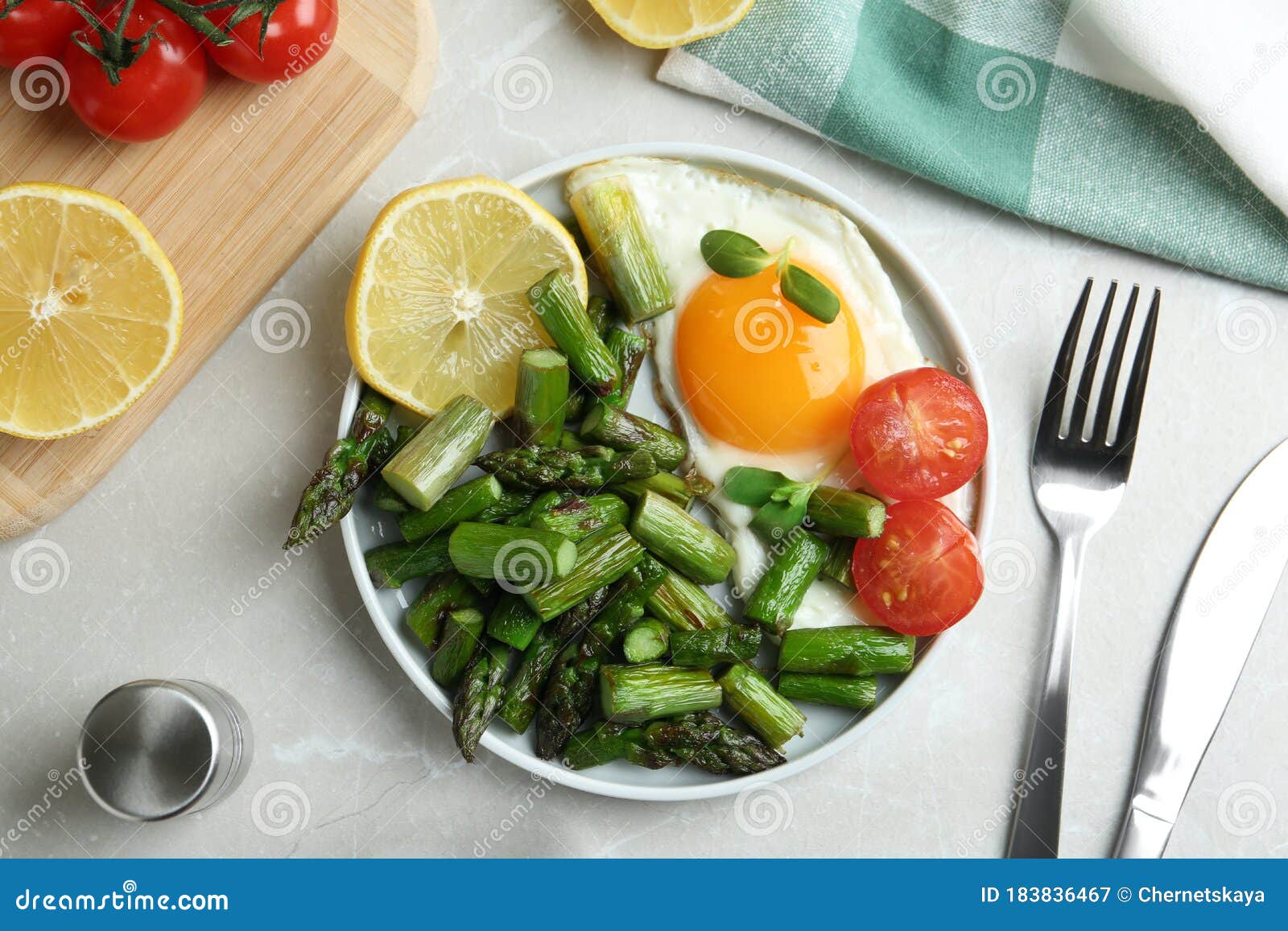Oven Baked Asparagus Served With Fried Egg On Grey Marble ...