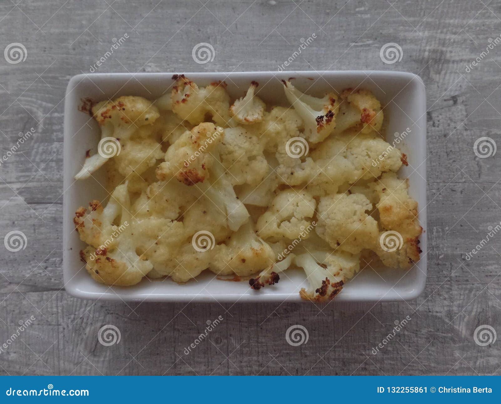 Oven Baked Cauliflower Cheese in a Rectangular White Dish Stock Image
