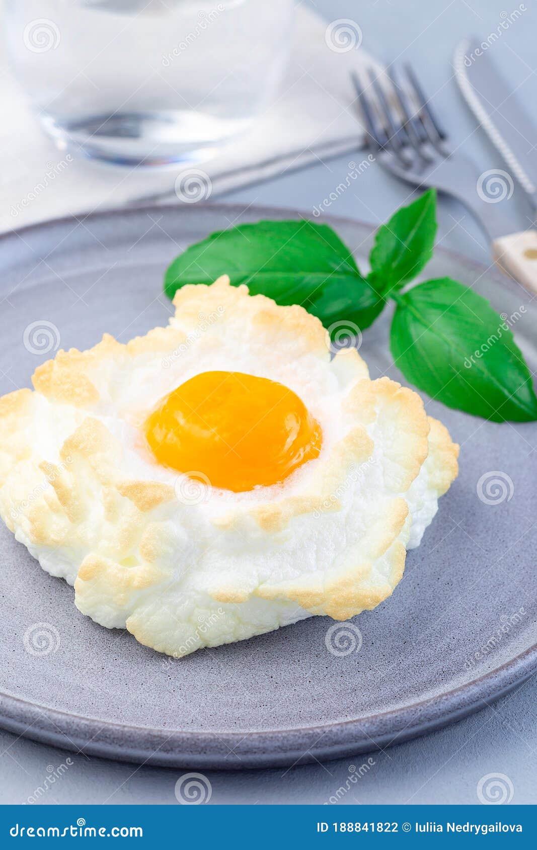 Oven Baked Cloud or Fluffy Egg Dish on Gray Plate, Vertical Stock Photo