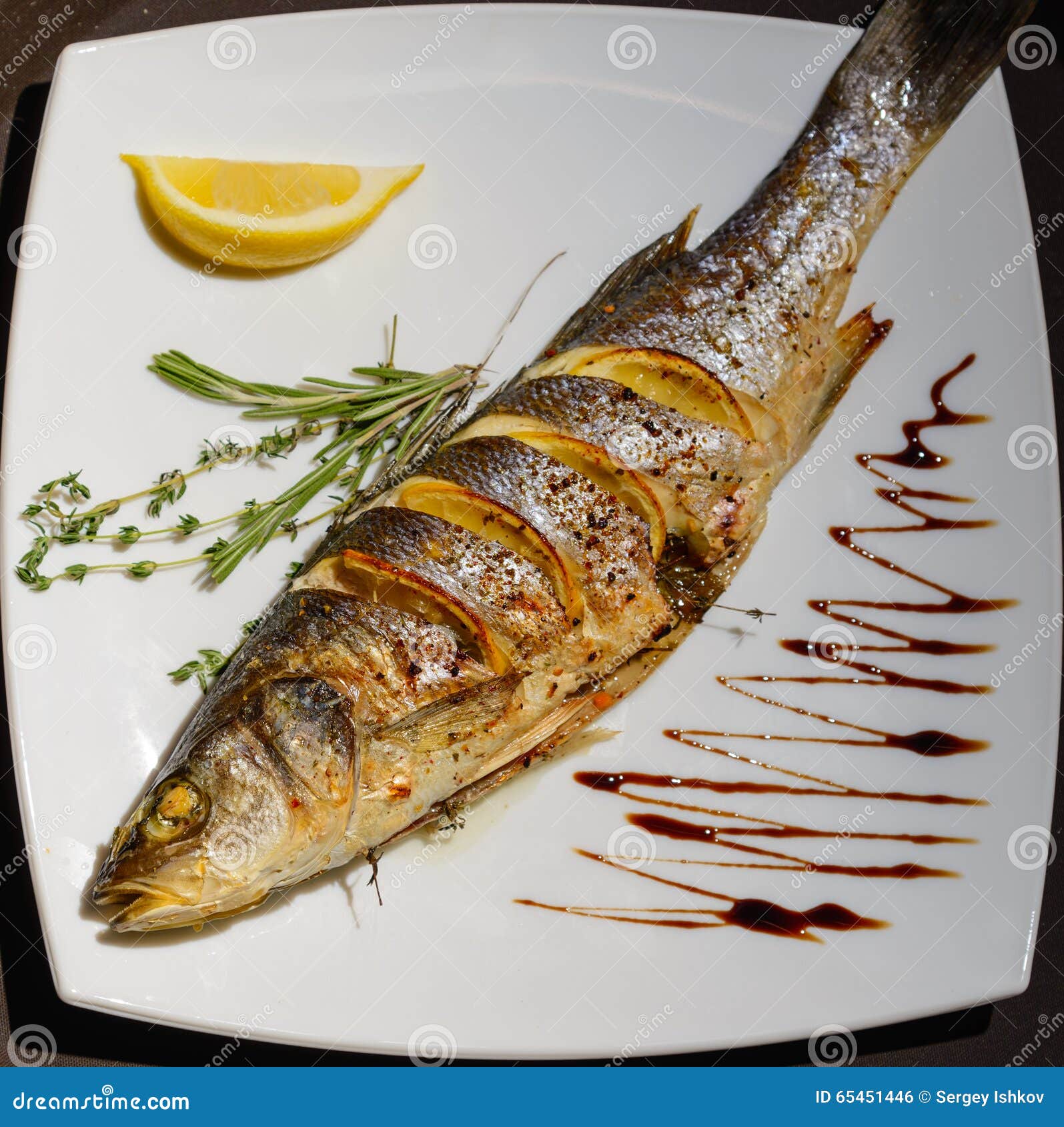 Ovenbaked Sea Bass with Lemon and Herbs Stock Photo Image of fried