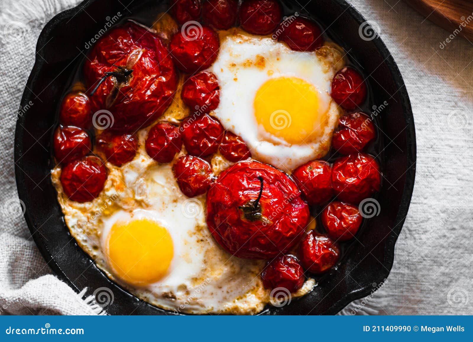Oven Roasted Tomatoes and Sunny Side Up Eggs in a Cast Iron Skillet