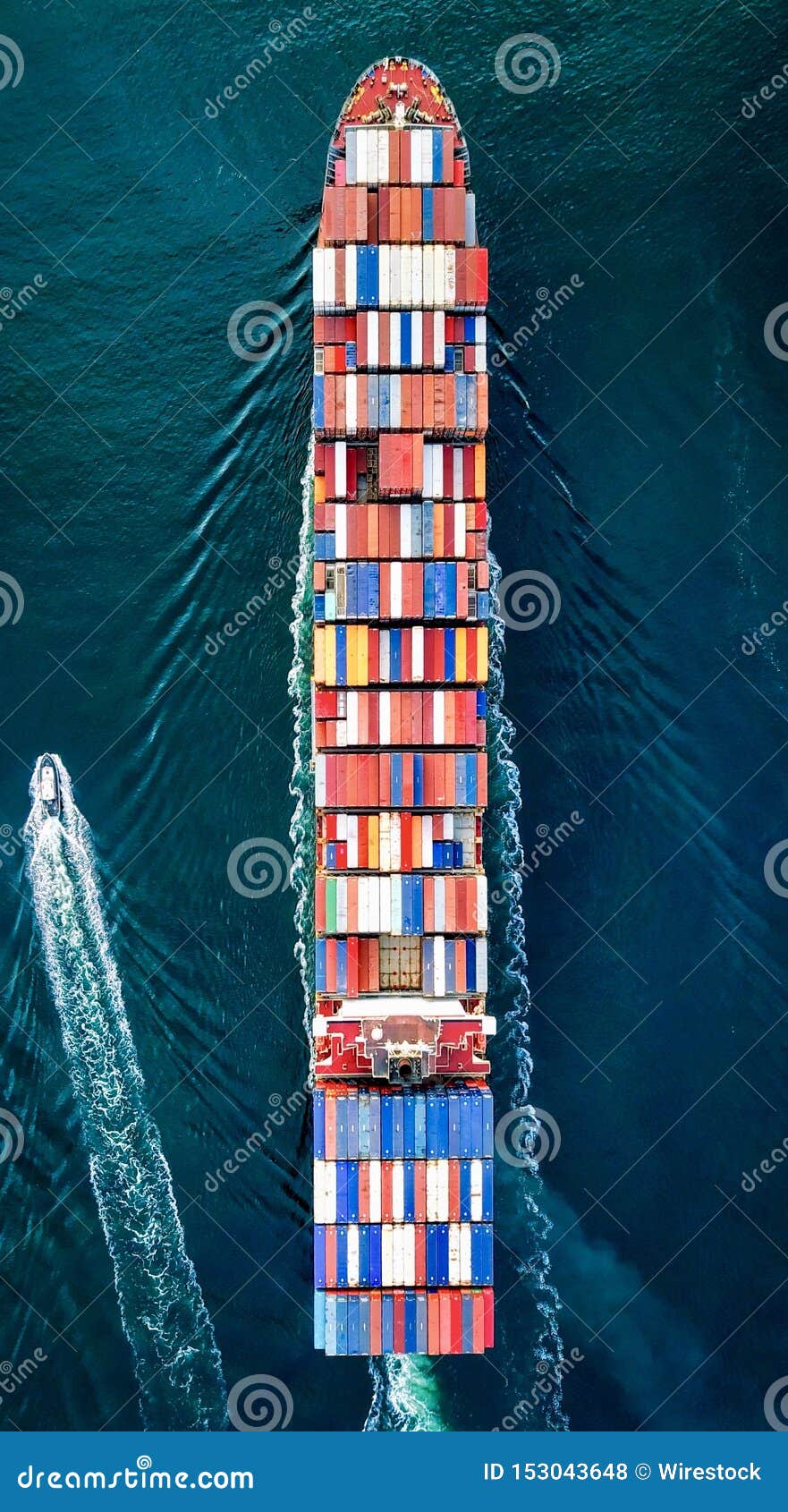 Overhead Shot of a Large Container Carrier Ship on the Water with