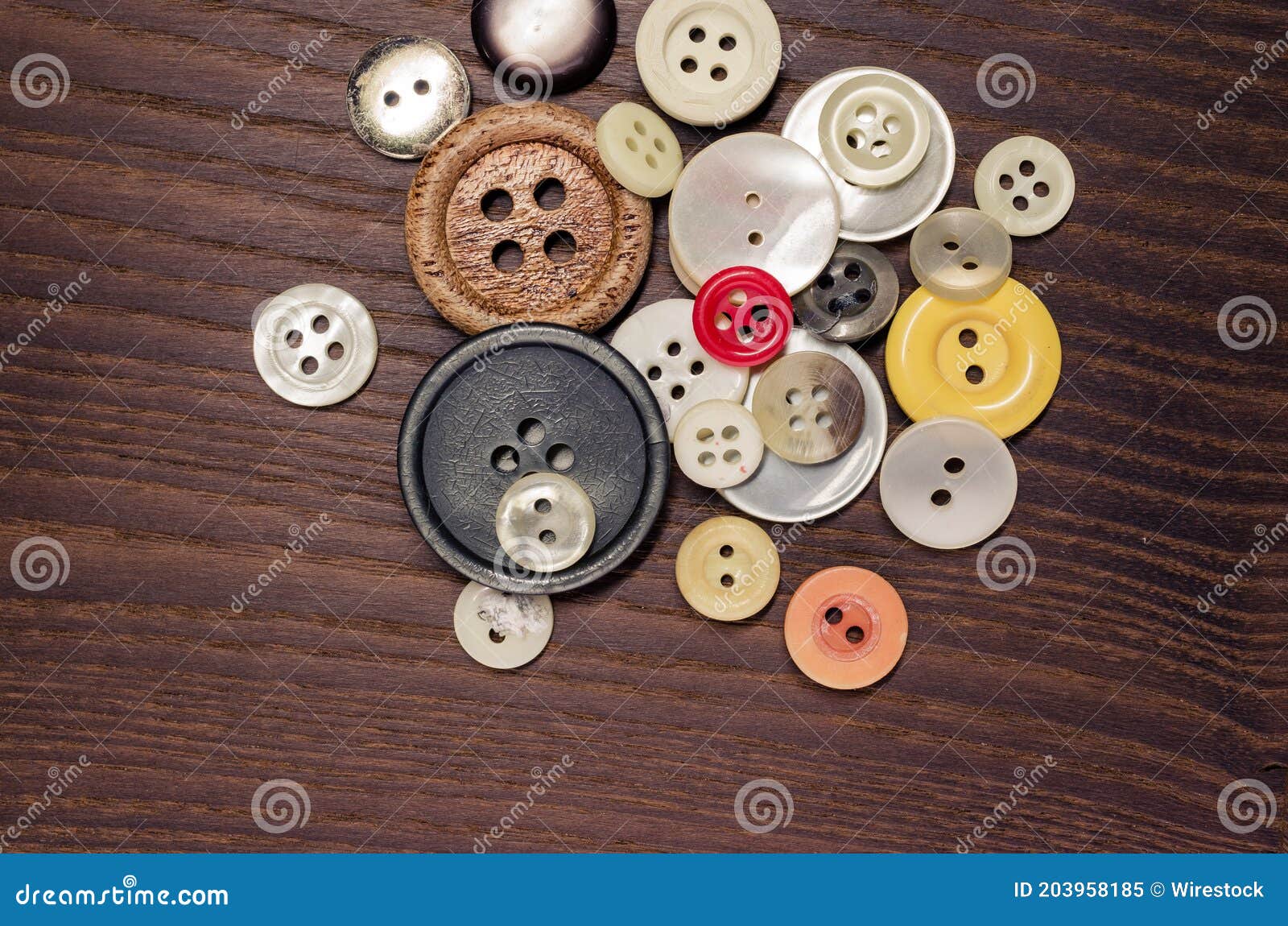 Overhead Shot of Old Clothing Buttons on a Dark Wooden Background Stock ...