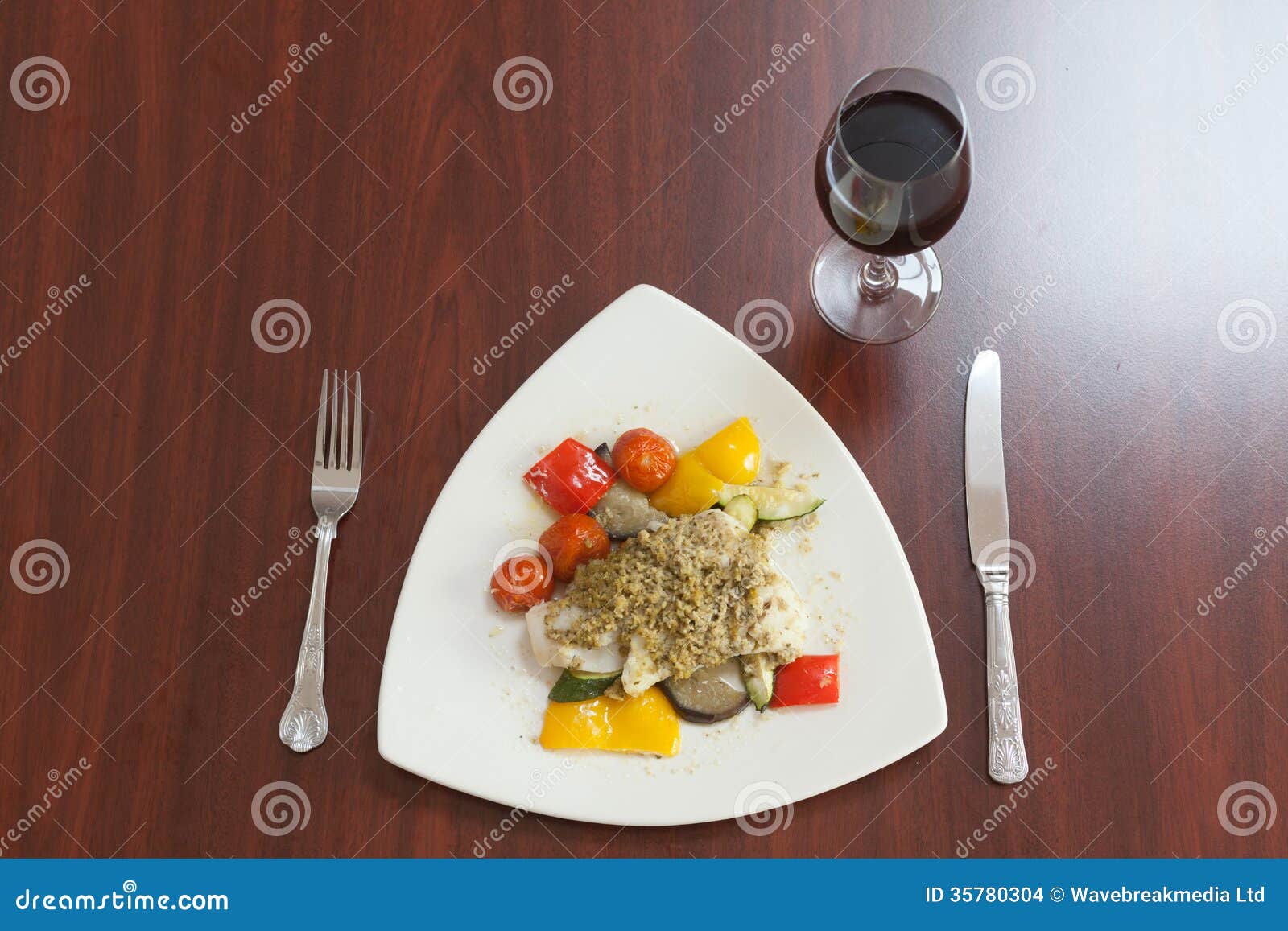 Overhead View of Delicious Fish Dish with Red Wine Stock Photo Image