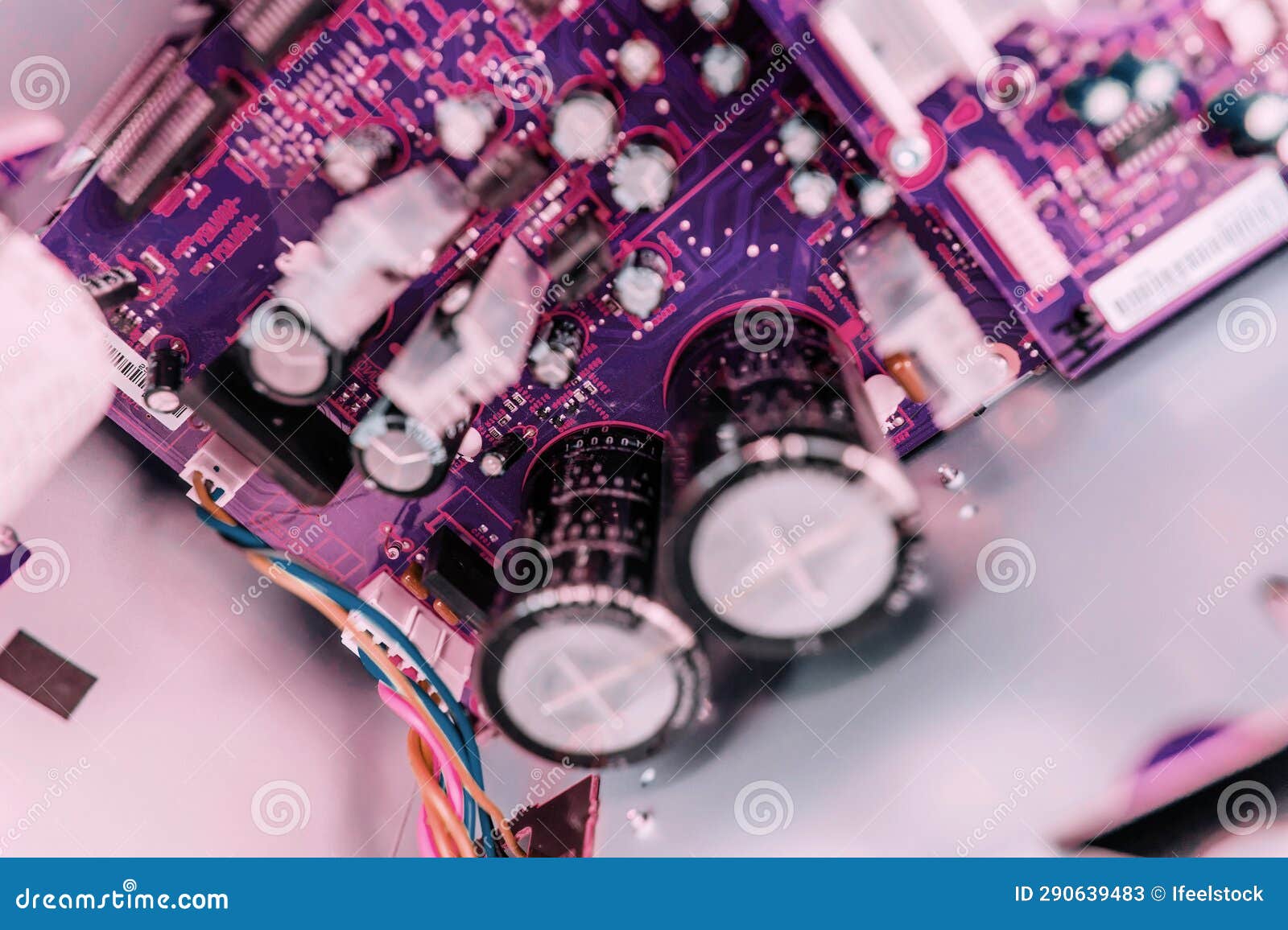 overhead view: large capacitors in class d amplifier with transistors and cpus