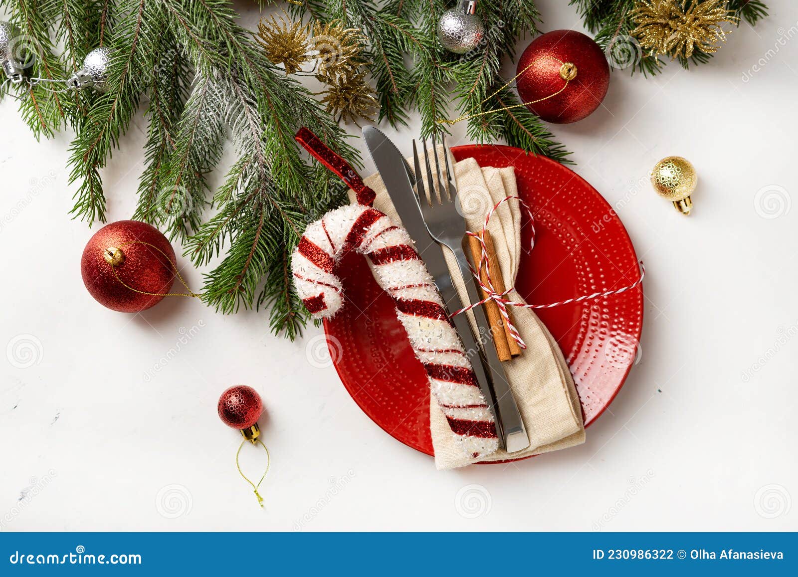 Overhead View of Red Christmas Plate with Decorations Holiday Table