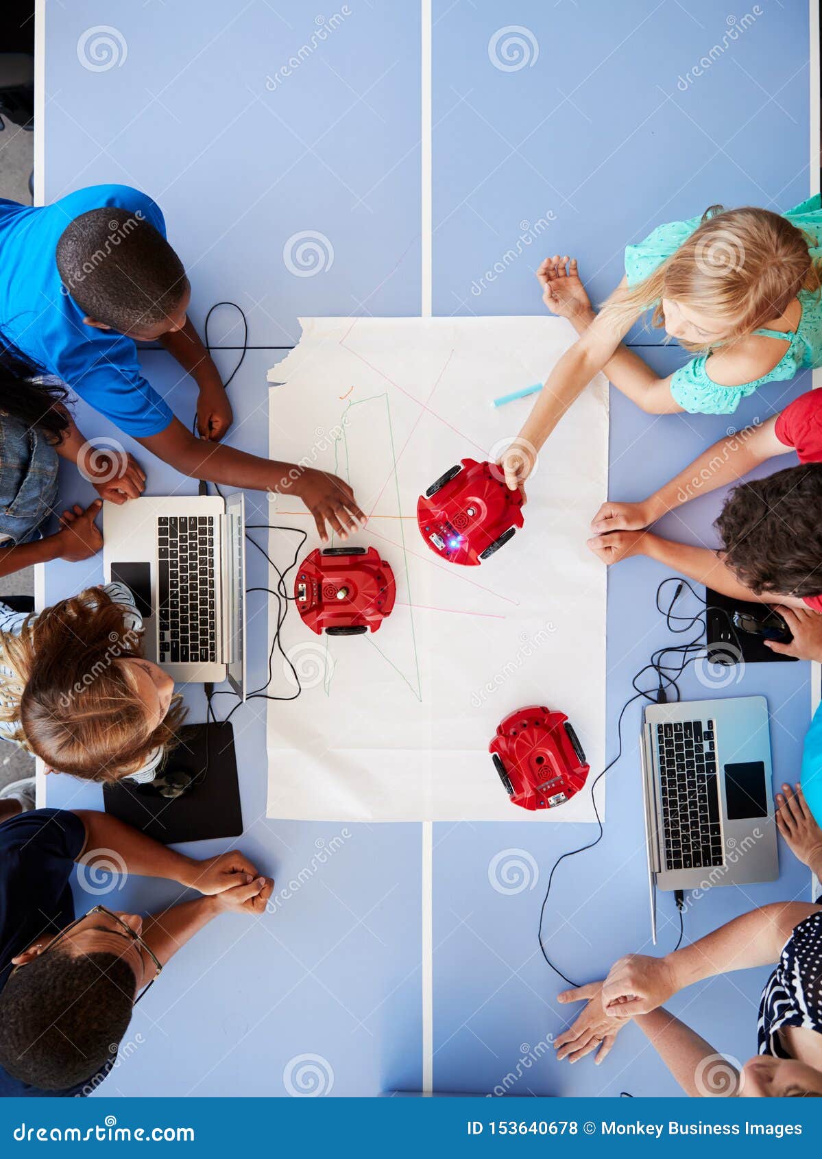 Overhead View of Students in after School Computer Coding Class