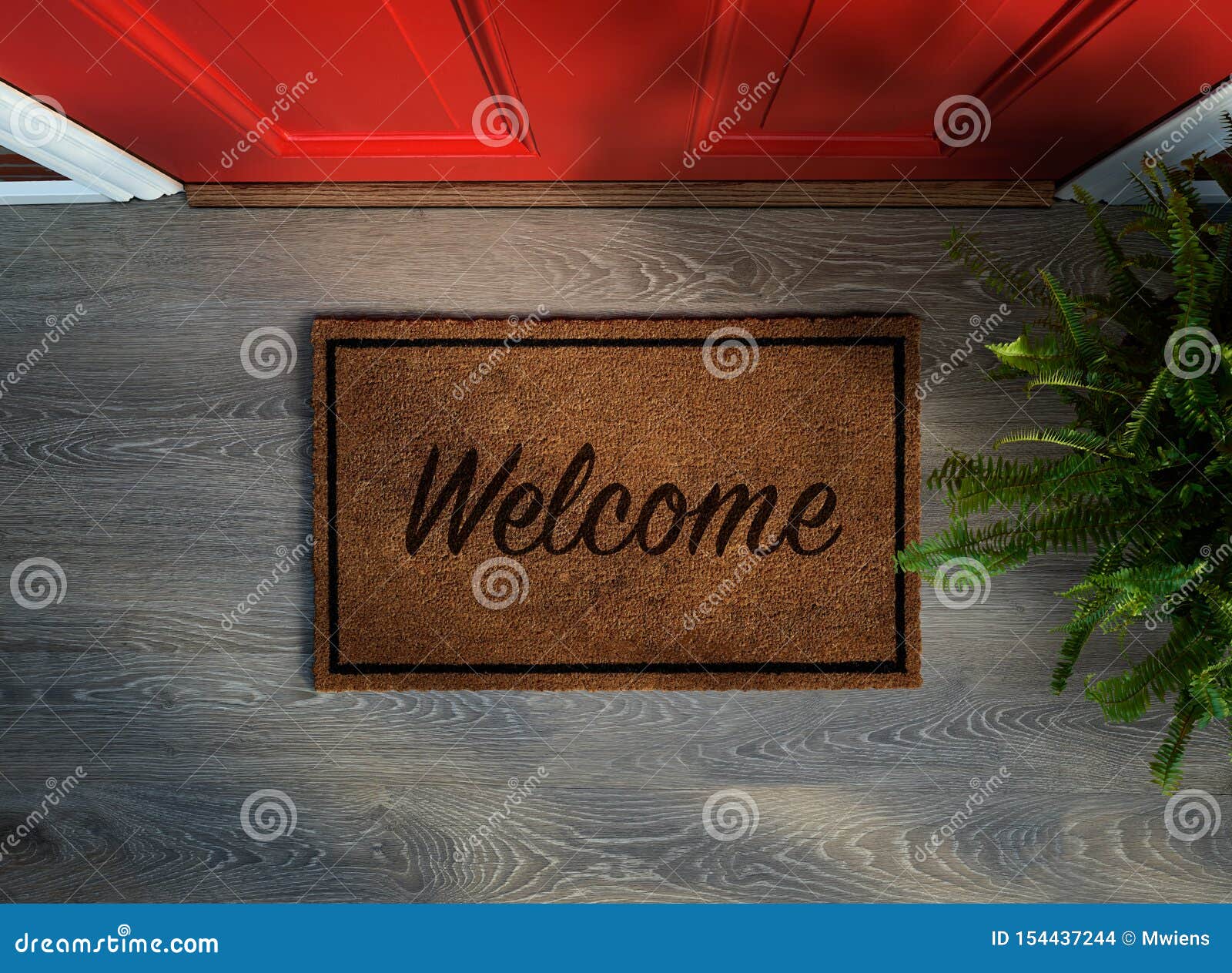 overhead view of welcome mat outside inviting front door