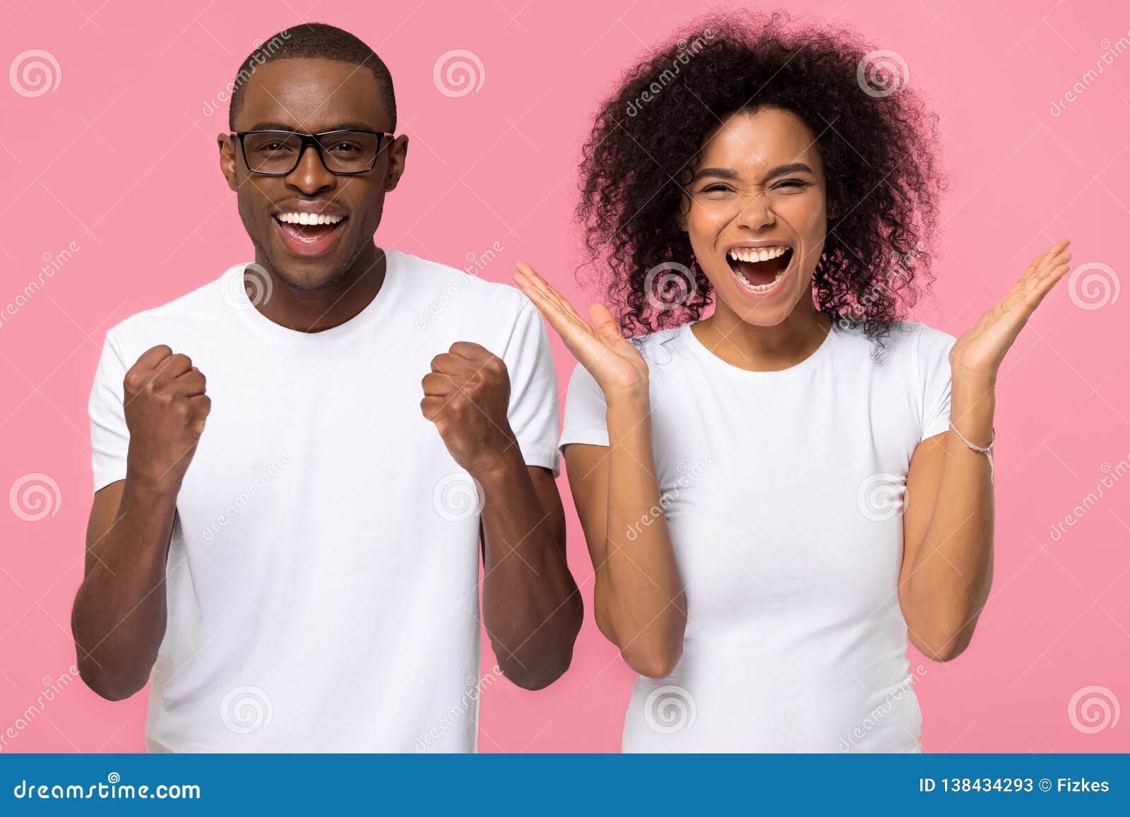 overjoyed excited african american family couple winners celebrate victory