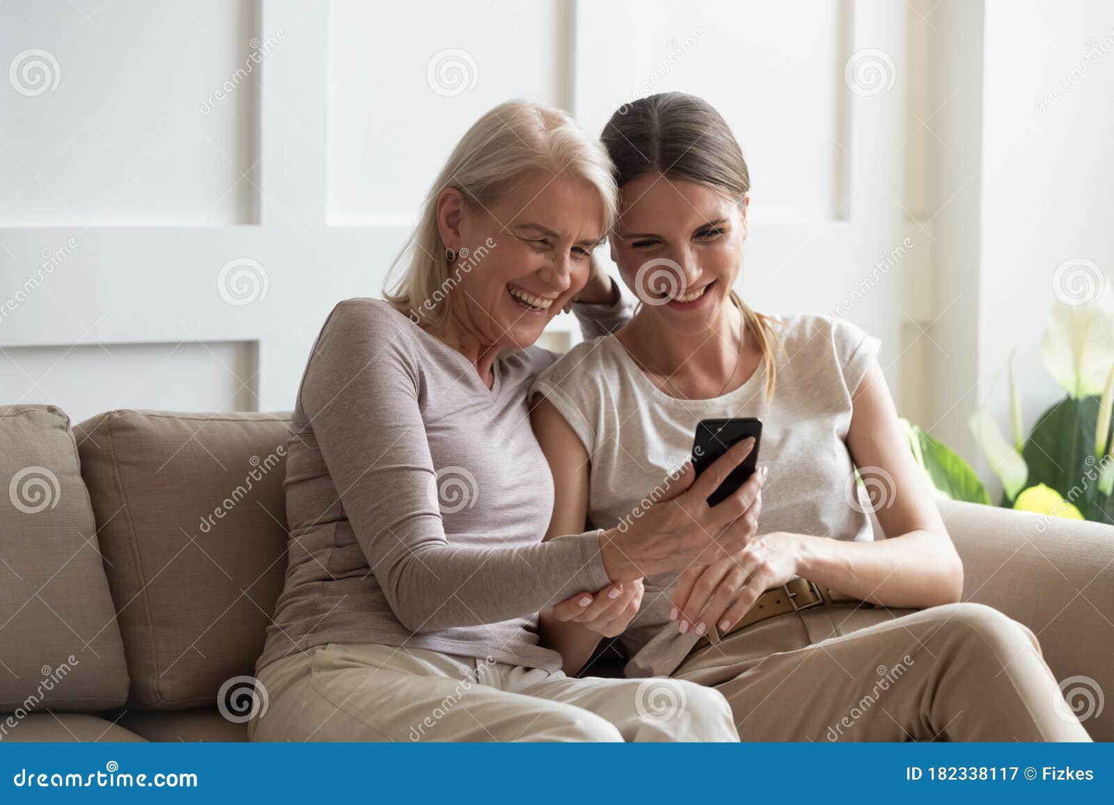 Overjoyed Mature Mom and Adult Daughter Watch Funny Video Stock Image -  Image of overjoyed, mature: 182338117