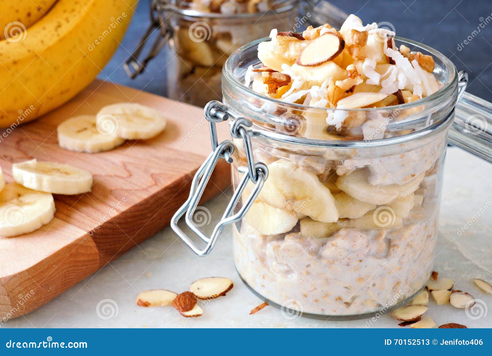 overnight oats with bananas and nuts in glass canning jars