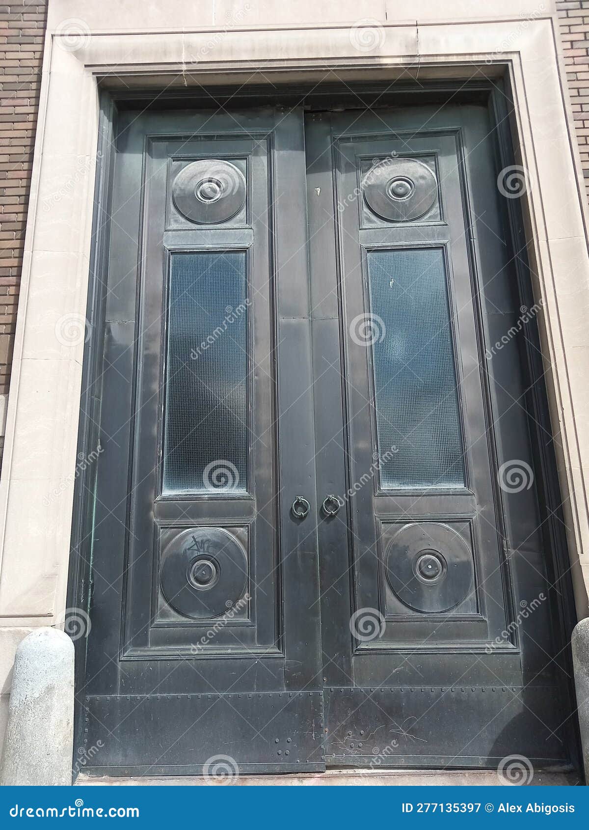 Oversized Black Iron Doors on a Building Entrance Stock Image Image