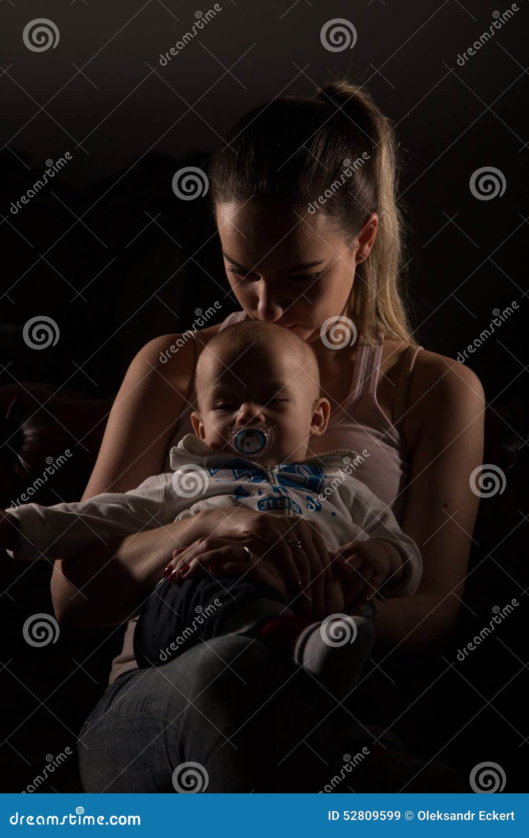 overtired single mother with her baby