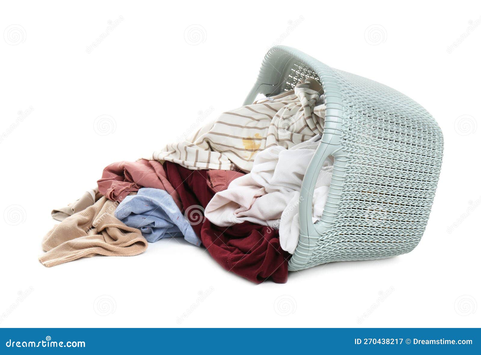 Overturned Laundry Basket Full of Clothes Isolated on White Stock Image