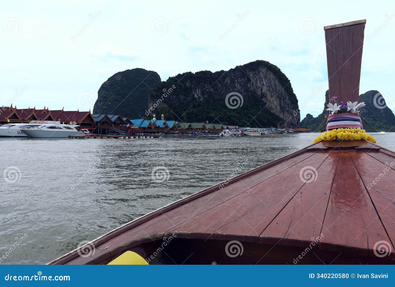 overview of koh panyi floating muslim village from traditional longtail speedboat