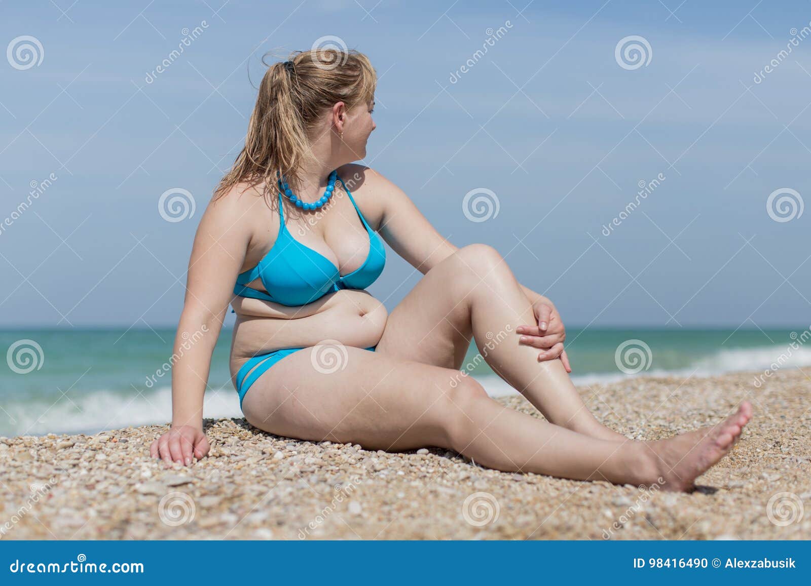 overweight blond at the sea