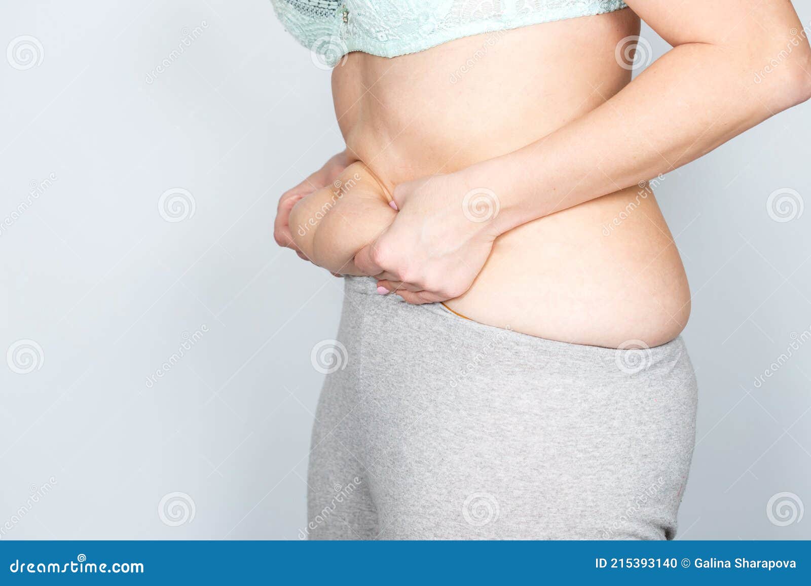 Overweight or Fat Adult Woman Hand Holding Belly Stomach in Very Tight Pants  Stock Photo - Image of weight, sports: 215393140