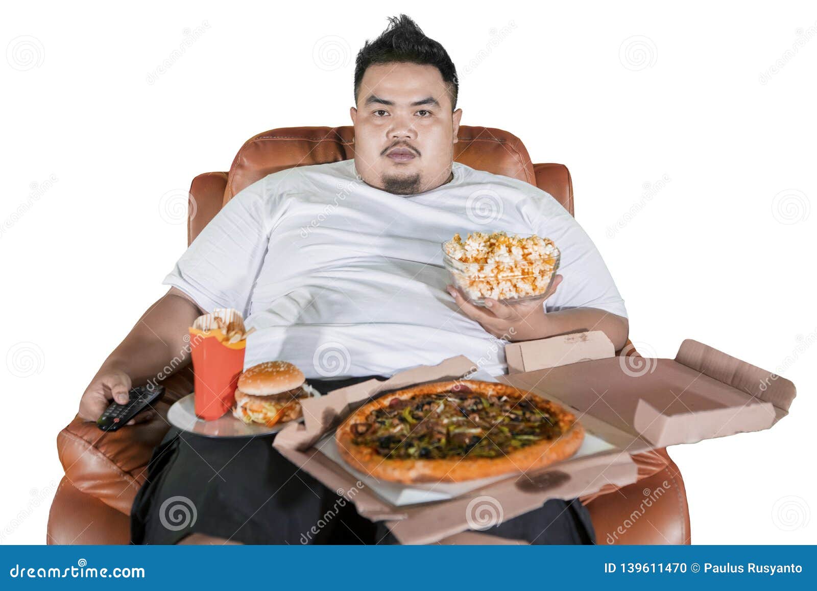 Greedy man watching TV while eating junk, Stock Video