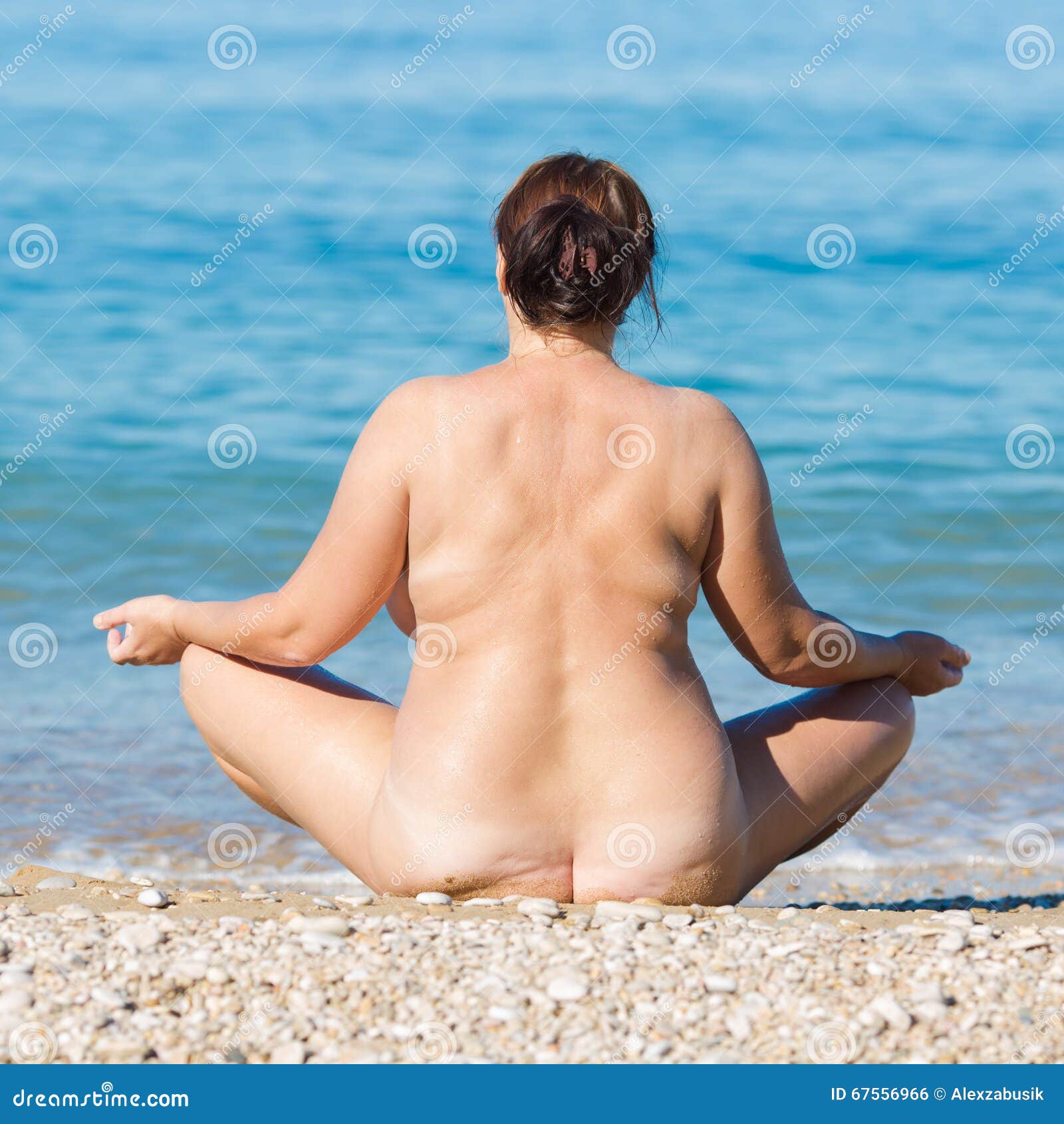 Photo about Overweight middle aged woman at the sea. 