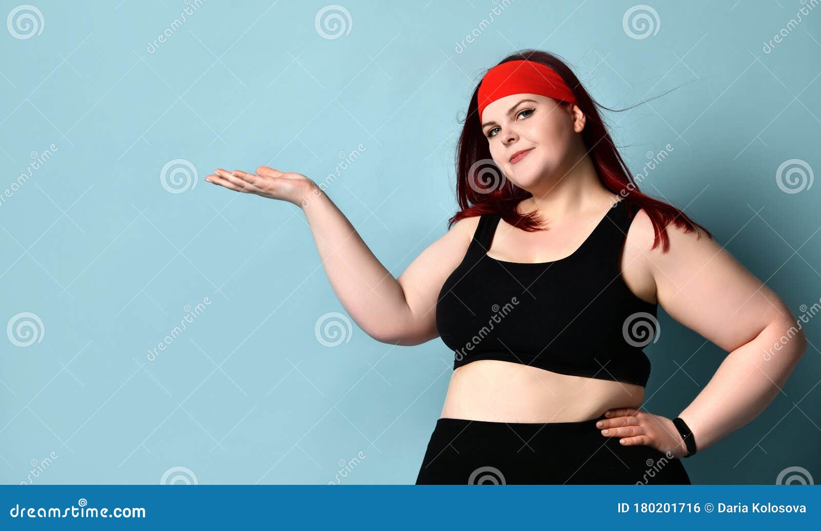 Overweight Redhead Female in Red Headband, Black Top and Leggings. she ...