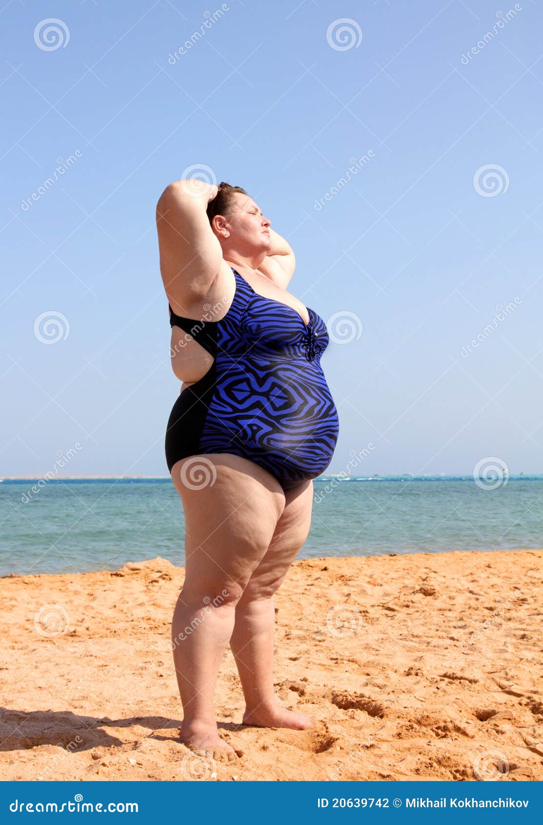 Overweight Woman on Beach with Hands Up Stock Photo - Image of large