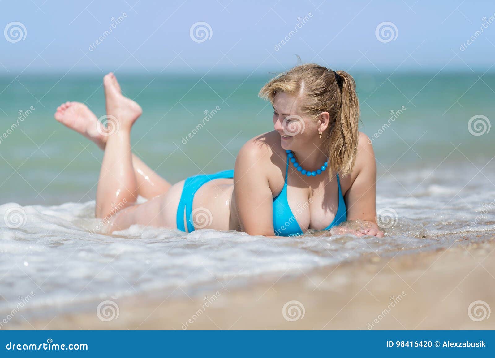 Young Girl Walking On The Beach In A Swimsuit 5884988 Stock Photo At  Vecteezy