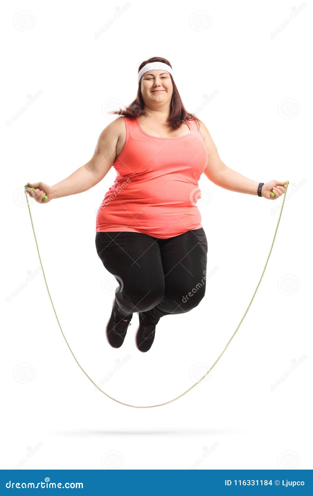 Overweight Woman Exercising with a Skipping Rope Stock Photo