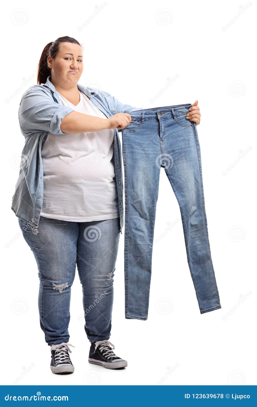 Overweight Woman Holding a Pair of Small Jeans Stock Photo - Image of ...