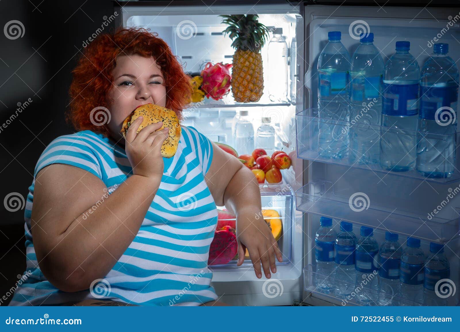 overweight woman with refrigerator