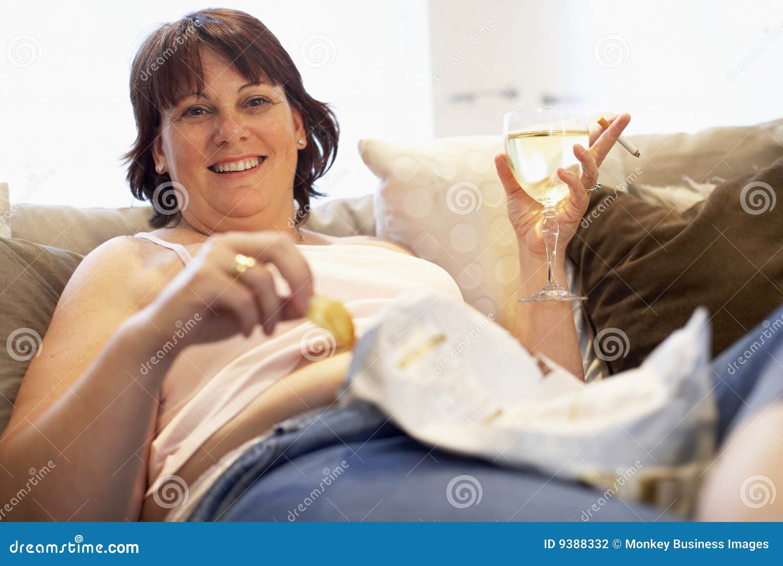 Overweight Woman Relaxing on Sofa Stock Photo Image of gain, girl 9388332