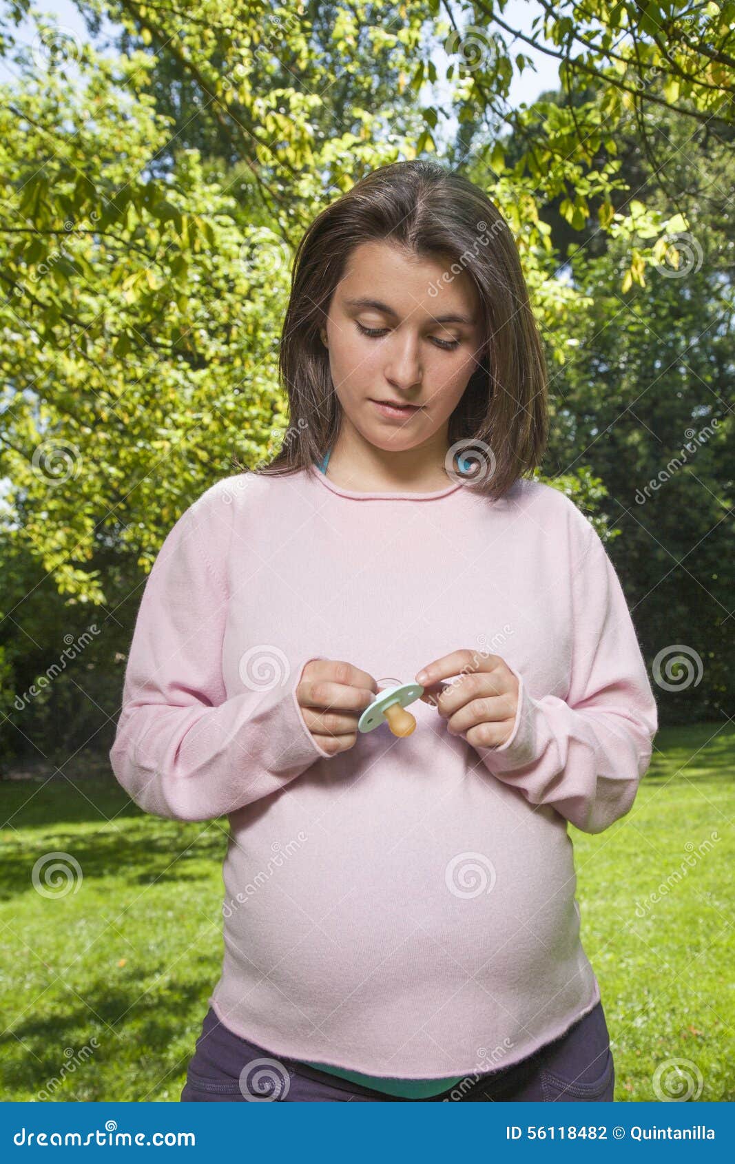 pacifier in mum hands